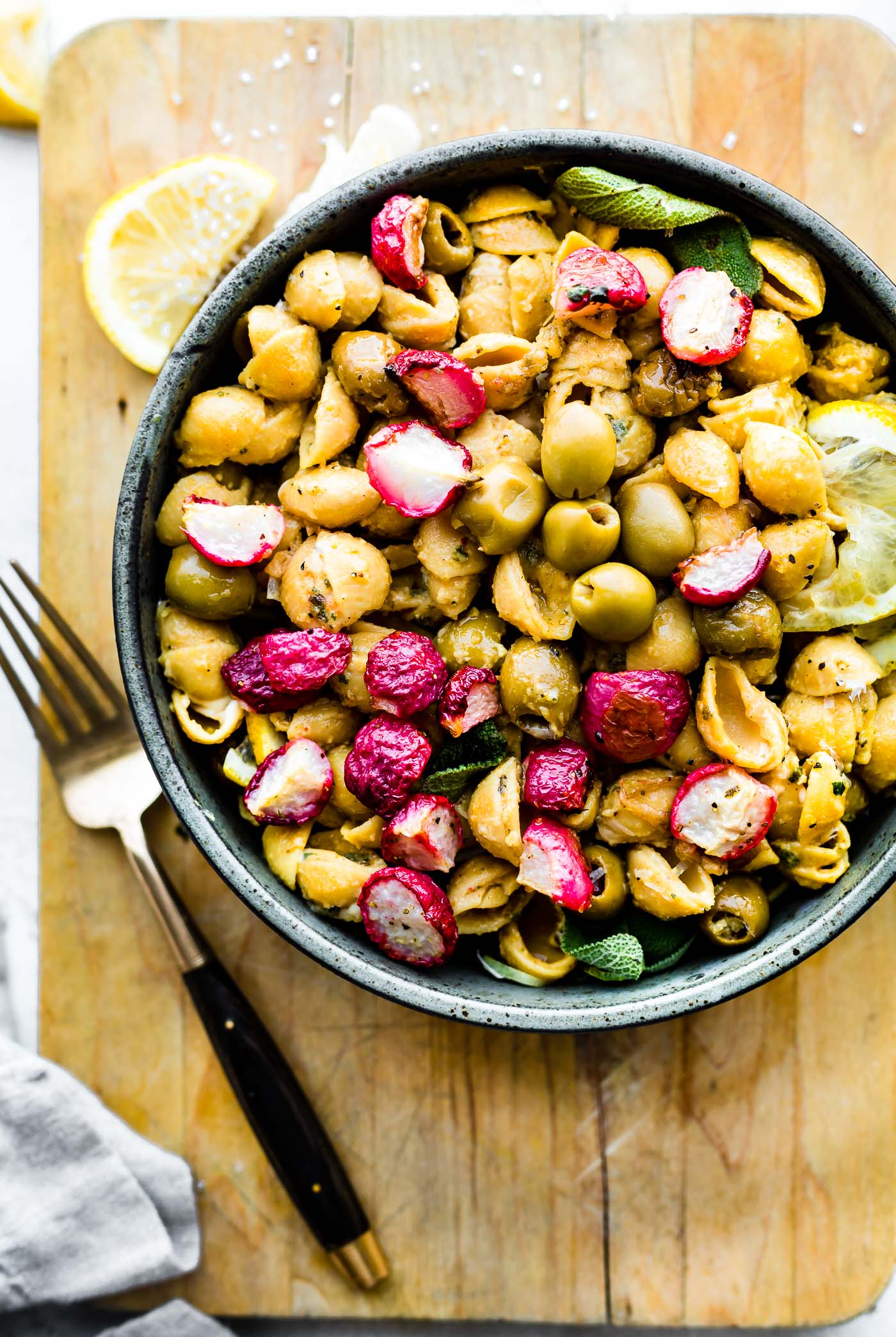 Roasted Radish Lemon Chickpea Pasta with olives! This vegan chickpea pasta recipe is packed with lemony flavor, making it the perfect light, gluten free pasta dinner for summer! #pasta #vegan #healthy #glutenfree #dinner #cleaneating 