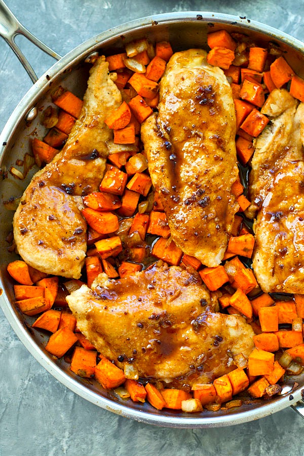 These flavorful skillet chicken breasts bake up in only one pan with an incredible sweet potato hash and an insanely-good maple glaze.--- This 30-minute skillet dinner is a weeknight keeper!