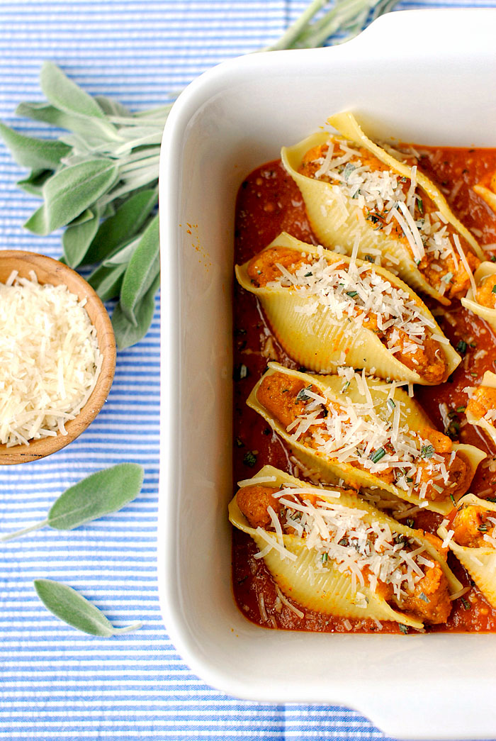 These Pumpkin and Sage Stuffed Shells are the perfect Fall recipe with flavors like cinnamon and nutmeg and less than 300 calories per serving!