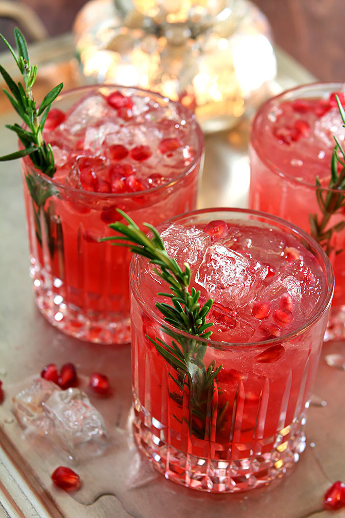 Christmas Gin Drinks
 Pomegranate and Rosemary Gin Fizz Cocktails DrinkWire